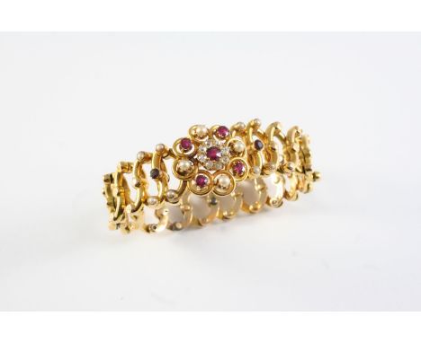 A GOLD, RUBY, DIAMOND AND PEARL SET EXPANDING BRACELET the oval link flexible bracelet is centred with a circular-cut ruby an