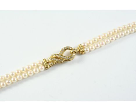A CULTURED PEARL AND DIAMOND BRACELET the uniform cultured pearls measure approximately 4.7mm and are set to an 18ct gold scr