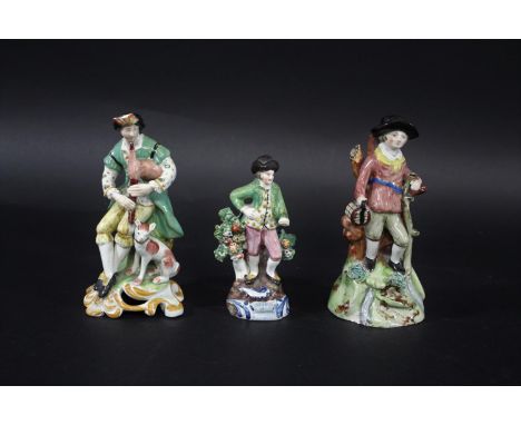 PEARLWARE FIGURES including a figure of a Bagpipe player with Dog by his feet (restored and damages), a figure of a Gent with
