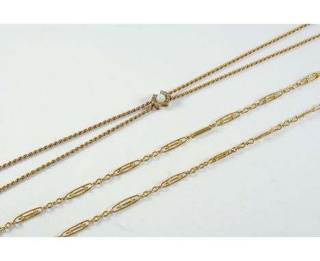 A GOLD ROPE LINK SLIDE NECKLACE the slide mounted with a circular white opal, 121cm long, 12.0 grams, together with an 18ct g