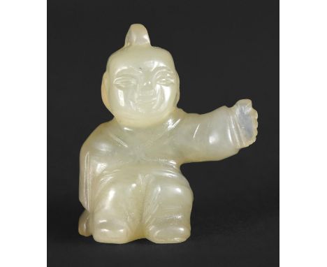 CHINESE JADE PENDANT a yellow jade miniature pendant in the form of a crouching boy with arm outstretched, probably Qing Dyna