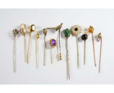 TWENTY SIX ASSORTED STICK PINS a garnet and seed pearl cluster stick pin, a gold stick pin mounted with a circular garnet, a 