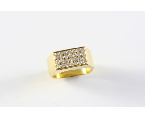 A DIAMOND PLAQUE RING formed with four rows of single-cut diamonds, in 18ct gold. Size K 1/2