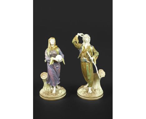 RARE PAIR OF ROYAL WORCESTER INDIAN FIGURES an unusual pair of Chinguin Indian figures, the male and female figures painted i