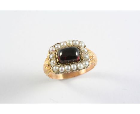 A GEORGIAN GARNET AND PEARL SET RING the rectangular-shaped cabochon garnet is set within a surround of half pearls, with eng