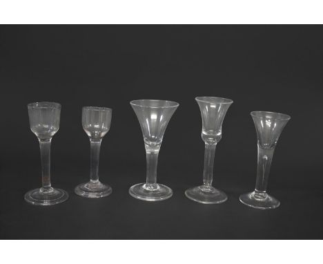 ANTIQUE WINE GLASS probably 18thc with an ogee shaped bowl, plain stem and conical foot (15cms high), also with a similar gla