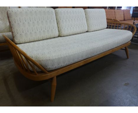 An Ercol Blonde ash and beech 355 model studio couch. Purchased by the vendor from Hopewells, Nottingham 2017 for £2,197 