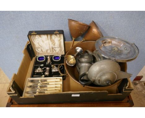 A box of mixed metalwares, a copper shallow two handled pan, two funnels, a hammered pewter tea service, plated basket, plate