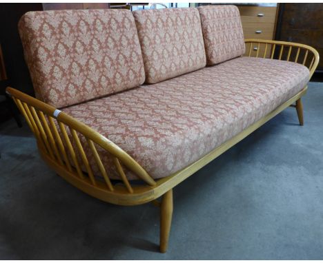 An Ercol Blonde elm and beech 355 model studio couch 
