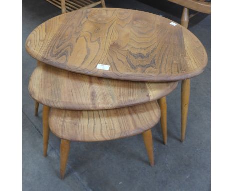 An Ercol Blonde elm and beech pebble shaped nest of tables 