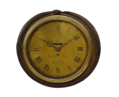 Decorative carved mahogany wall clock, with 12" circular brass dial having Roman hours and Arabic minutes framing mock pendul