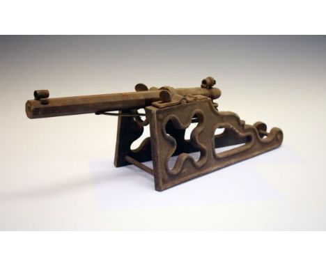 Model cannon, possibly a garden ornament, octagonal barrel 32cm with hooded front sight and peep rear sight, mounted on an ir