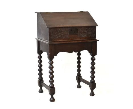 William & Mary oak Bible box, the slope front with notched carving and incised star decoration to hinged fall, over a well ca