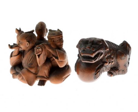 Japanese carved boxwood okimono, Meiji period, depicting three men seated back to back, two character mark possibly reading S