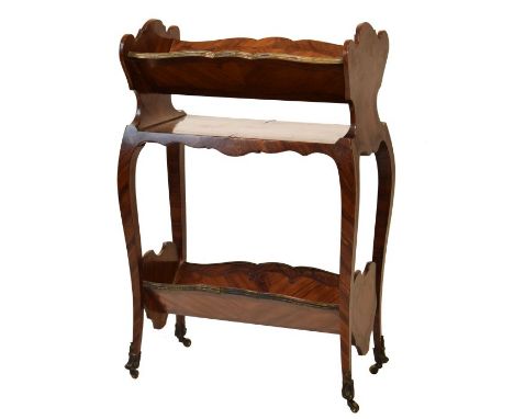 Late 19th/early 20th Century French kingwood and tulipwood book trough, the shaped superstructure with brass bound V shaped b