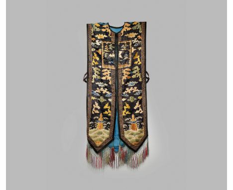 A CHINESE EMBROIDERED LADY’S TUNIC, 18TH CENTURY Decorated with swirling clouds and shou characters above waves crashing agai