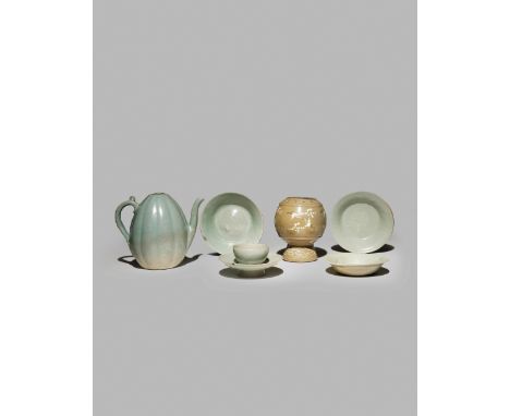 SIX KOREAN CELADON GLAZED ITEMS, KORYO DYNASTY AND LATER Comprising a melon-shaped ewer with incised lotus designs, three dis