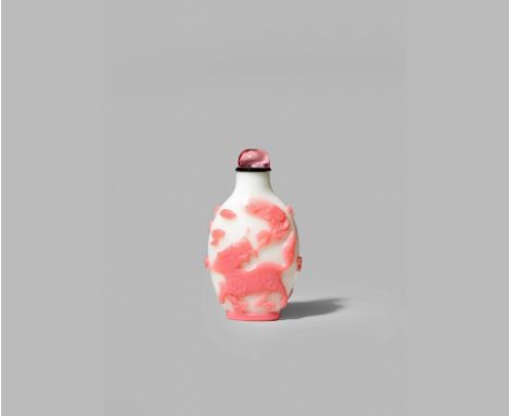 A CHINESE PINK OVERLAID GLASS SNUFF BOTTLE, 1780-1850 Of flattened ovoid form, carved in shallow relief to one side with a ky