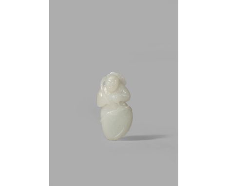 A CHINESE PALE CELADON JADE CARVING OF A BOY, 18TH/19TH CENTURY Standing in a large upturned lotus leaf, a flower stem held o