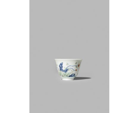 A CHINESE IMPERIAL WUCAI ‘MONTH’ CUP, SIX CHARACTER QIANLONG MARK AND OF THE PERIOD 1736-95 Painted in underglaze blue, iron-