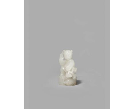 A CHINESE WHITE JADE FIGURE OF A BOY, QING DYNASTY OR LATER With one foot raised on a drum-shaped seat with a tiger at his si