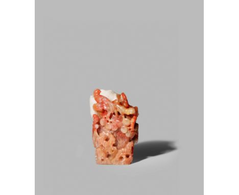 A CHINESE AGATE VASE, 19TH/20TH CENTURY Carved as a section of a tree trunk, with gnarled pine branches and bamboo extending 