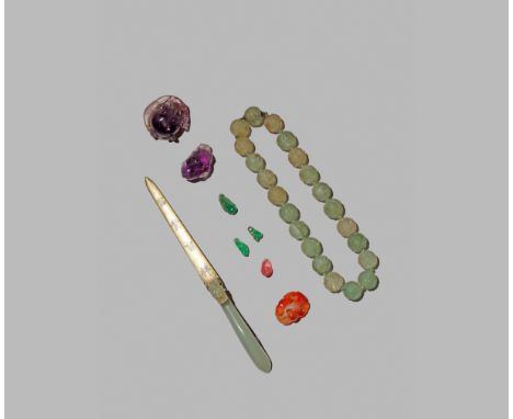 A CHINESE PALE CELADON JADE BELT HOOK, QING DYNASTY Converted into a paper knife, seven small hardstone and jade carvings, to