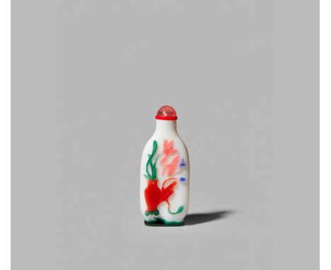 A CHINESE GLASS SNUFF BOTTLE, 1750-1820 The flattened body overlaid in red, green, yellow, pink and blue, carved in relief to