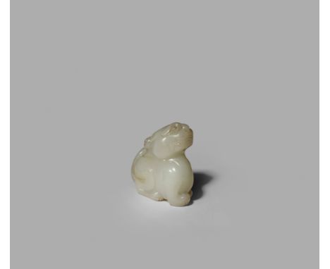 A SMALL CHINESE PALE CELADON JADE MODEL OF A TIGER, QING DYNASTY OR LATER Crouching with its head raised and an expectant exp