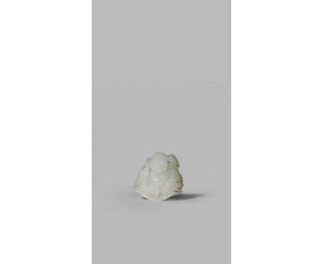 A SMALL CHINESE WHITE JADE CARVING OF BUDAI HE SHANG, QING DYNASTY OR LATER Seated on a large lotus leaf, with another thrown