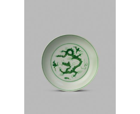 A RARE CHINESE IMPERIAL GREEN ENAMELLED ‘DRAGON’ DISH, SIX CHARACTER ZHENGDE MARK IN UNDERGLAZE BLUE AND OF THE PERIOD 1506-1