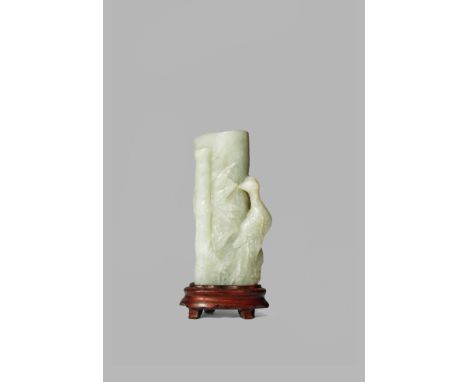 A CHINESE CELADON JADE VASE, LATE QING DYNASTY The elongated body carved as a section of bamboo, with leaves and lingzhi fung