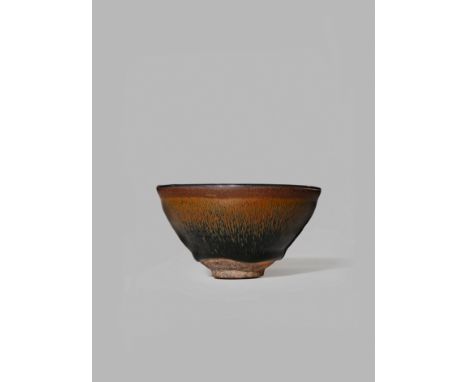 A CHINESE JIANYAO BOWL, SONG DYNASTY 960-1279 AD The conical body decorated with a brown-black glaze stopping short of the fo