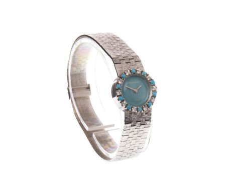 LADY'S BEUCHE GIROD WHITE GOLD, TURQUOISE AND DIAMOND MANUAL WIND WRIST WATCH, the round turquoise dial lacking numerals, wit