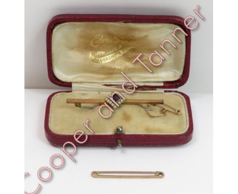 An amethyst and seed pearl bar brooch, unmarked, 5.3 cm long, cased; with a bar brooch pin, stamped '9ct'; 3.7 g gross