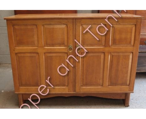 An Art Deco light oak cupboard, with fielded panel doors, cutlery drawer and adjustable shelves. Probably by Heal's, 91cm hig