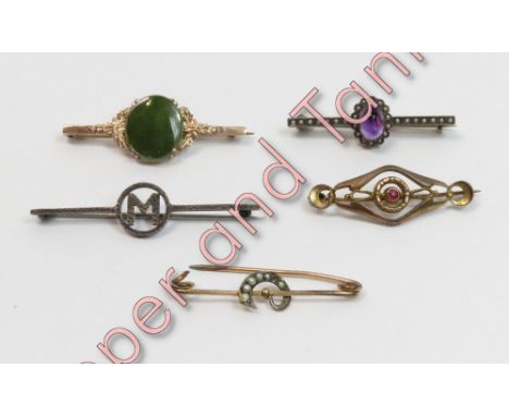 A jade set bar brooch, indistinctly stamped; a seed pearl set bar brooch; an amethyst cabochon and seed pearl bar brooch; an 