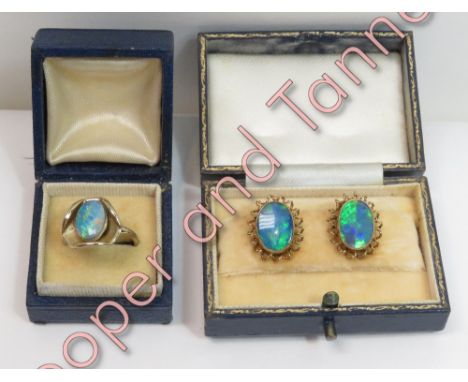 A pair of opal doublet earclips, stamped '9ct', 4.5 g gross, cased; with an opal doublet metal ring