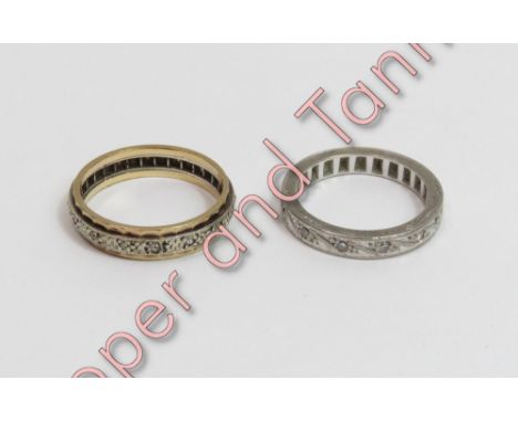 A diamond eternity ring, the white metal engraved to the sides and marked '18ct'and numbered '51', set with twelve single cut