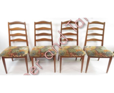 A set of four G Plan dining chairs with ladder backs and upholstered seats