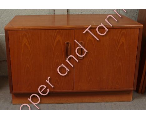 A G Plan teak low cupboard with pair of doors enclosing shelf, 54cms high 81cms wide