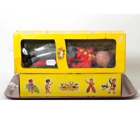 A Pelham Puppet - Golly in original box; another of a soldier, boxed (3) 