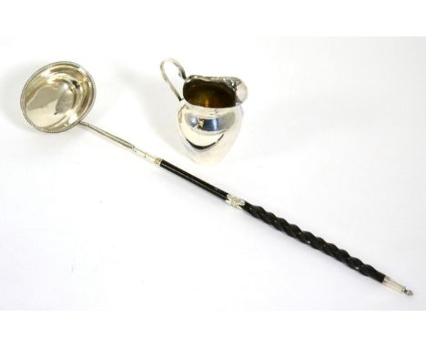 A George III silver toddy ladle, makers mark TS, circa 1800; together with a small silver cream jug