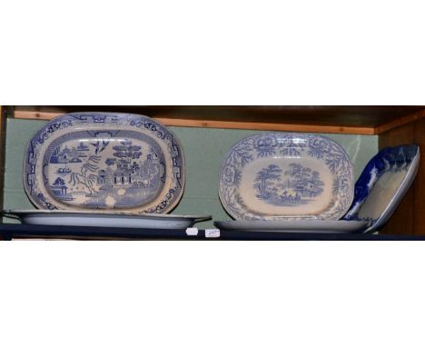 Shelf of blue meat plates and tureens on two shelves 