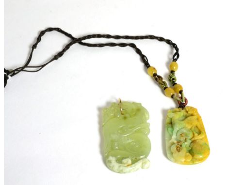 A jade pendant and a bowenite pendant