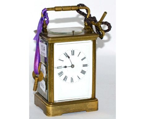 A brass striking and repeating carriage clock