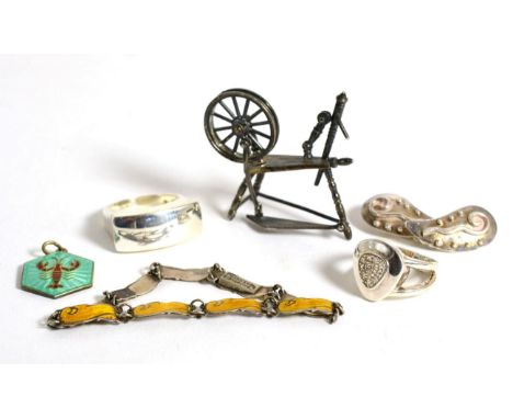 Miniature silver spinning wheel and five items of silver and enamel jewellery 