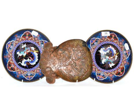 A Japanese Meji plaque (a.f.) and a pair of cloisonne plates 