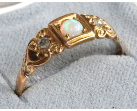 An opal and diamond ring, stamped '22'