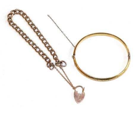 A curb link bracelet and a bangle 
